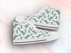 These cute green dinosaur shoes are sure to attrack some attention ! Our custom made shoes will make the best gift for any occasion! All of our sneakers are custom-made-to-order and handcrafted to the highest quality standards Check out more of our footwear here: https://www.etsy.com/shop/unicornshoesshop/ Product Name: Dinasaur Print Shoes | Sneakers | Dinasaur Women Shoes | Dinasaur Pattern | Custom High Top Converse Style Sneakers For Women & Men Product Features; ▶ Full canvas double sid Cute Green Dinosaur, Dinosaur Shoes, Star Wars Shoes, Style Converse, High Top Converse, Green Dinosaur, Christmas Shoes, Custom Made Shoes, Converse Style