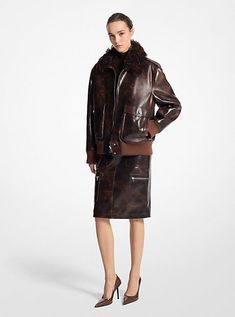 A utility essential is reinvented in rich burnished leather. Designed with classic flight jacket details—including front pockets and ribbed trim at the cuffs and hem—this luxe bomber is finished with an elegant shearling collar. Recreate our runway look and team it with the coordinating skirt and pumps. Jacket Details, Michael Kors Collection, Flight Jacket, Flight, Bomber Jacket, Michael Kors, Leather Jacket, Pumps, Trim