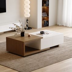 a living room with a coffee table, vase and bookshelf in the background