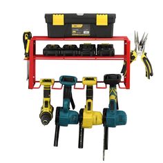 tools are hanging on a red rack with black and yellow accessories attached to the racks