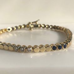 This is a beautiful sapphire and Diamond tennis bracelet, crafted in 14K yellow gold. Each stone is securely bezel set. This tennis bracelet is standard 7 inches with a sliding lock and safely hook. This is the Perfect bracelet to stack with others. 13.51 grams :14K Yellow Gold Approximately 2 carat natural blue sapphires and G/SI1 clarity diamonds. This would make a perfect "push gift" for the woman who is having a baby in September or a great birthday gift for the September birthday. ***With a Luxury Sapphire Yellow Gold Tennis Bracelet, Luxury Elegant Sapphire Tennis Bracelet, Diamond Tennis Bracelet Stack, Tennis Bracelet Stack, Push Gifts, September Birthday, Diamond Tennis Bracelet, Great Birthday Gifts, Tennis Bracelet Diamond