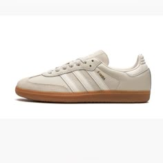 a white adidas sneakers with gum soles