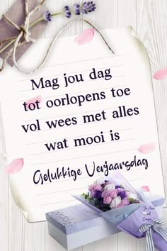 a greeting card with an image of flowers and a note that reads, mag jou dag tot ooppens toe vol wee met alles met alles wat mooi is watt mooi is