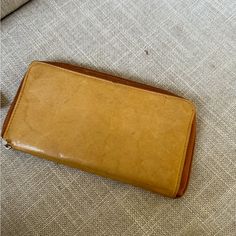 Genuine Leather Wallet. Smooth Refined Leather. Zip Around. Multiple Card Slots. New! Everyday Vintage Brown Clutch, Vintage Brown Everyday Clutch, Vintage Rectangular Wallets, Vintage Rectangular Everyday Wallet, Beige Leather Wallet With Zipper Closure, Everyday Vintage Wallet With Rfid Blocking, Vintage Rectangular Wallets For Everyday Use, Everyday Beige Bifold Wallet, Beige Leather Wallet For Daily Use