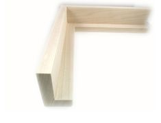 the corner of a wooden shelf against a white background