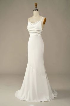 a white wedding dress on a mannequin