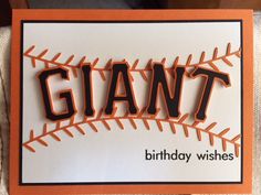 an orange and white birthday card with the word giants in black on top of it