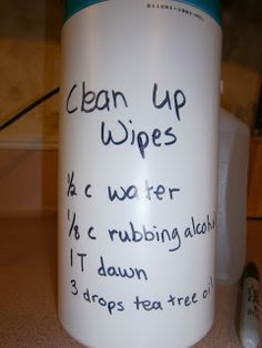 a coffee cup with writing on it sitting on a counter next to a toothbrush