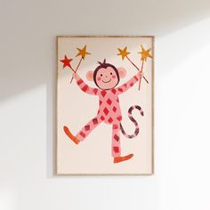 a child's artwork hangs on the wall