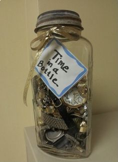 a jar filled with lots of different types of buttons