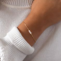 The perfect minimal pearl bracelet. Timeless, yet simple enough to wear everyday.  D E T A I L S: * Beautiful dainty chain * Freshwater pearls (approx 3mm)  * Hand-made in our happy little studio * Variety of lengths to choose from M A T E R I A L S: * All sourced from USA or Italy * 100% 14kt gold fill, rose gold fill, or sterling silver  * Comes in a cute little package ready for gifting HANDMADE WITH LOVE * All items are handmade with love in our happy Louisiana studio. * We use only highest Minimalist Adjustable Pearl Bracelet For Anniversary, Minimalist Gold Bracelet For Anniversary, Minimalist Pearl Bracelet With Charm As Gift, Minimalist Pearl Bracelets With Pearl Chain, Minimalist Beaded Bracelets With Pearl Chain, Minimalist Pearl Bracelets As Gift, Minimalist Pearl Bracelets For Gifts, Minimalist Pearl Bracelets For Gift, Minimalist Everyday Beaded Bracelet With Pearl Chain