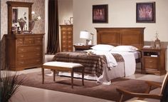 a bedroom scene with focus on the bed and dresser