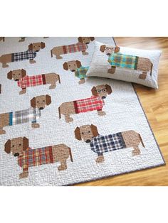 a quilted dog bed spread with glasses on it