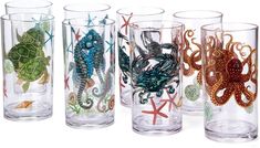 four glass cups with sea animals on them