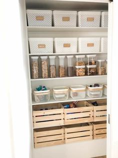 an organized pantry with bins and baskets