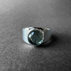 Natural Blue Tourmaline Silver Ring - Indicolite Tourmaline Ring Size 7 - Completely Handmade & Silver Gemstone: Blue Tourmaline (Indicolite)  Metal: Pure and 925 Sterling Silver Stone Cut: Cabochon Stone Size: 8.5 mm x 8.5 mm - 0.33 in - 0.33 in Weight: 5.2 grams (26 carats) total weight of stone and silver. For ring orders, ring resizing is free. Chains are gifts for necklace orders..  Note: We don't use any filters for photos. The details may not be clear. Feel free to contact us with any que Silver Tourmaline Rings For Formal Occasions, Polished Tourmaline Round Ring, Polished Tourmaline Rings, Modern Round Crystal Gemstone Ring, Modern Round Birthstone Ring With Gemstone, Modern Round Birthstone Ring, Silver Tourmaline Emerald Ring, Silver Tourmaline Birthstone Ring With Gemstone, Modern Birthstone Ring With Gemstone In Round Band