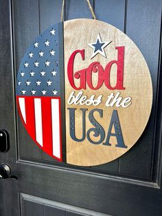 a door sign that says god bless the usa