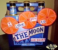 two oranges in a blue box with i love you to the moon and back