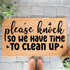 a door mat that says please knock so we have time to clean up