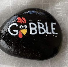 a rock with the word gobble painted on it