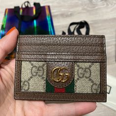 Authentic Gucci Ophidia Card Case, Like New With Tags Condition: Like New, Only Used Once, No Signs Of Wear, No Hairline Scratches, Could Pass As Brand New For Gifting! Comes With Original Dust Pouch, Original Box With Original Tags And Care Cards, Original Limited Edition Packaging And Gucci Ribbon For The Ultimate Gift! Brown Gucci Wallets With Interior Card Slots, Gucci Brown Wallets With Interior Card Slots, Designer Wallets With Card Slots For Daily Use, Designer Brown Card Holder For Daily Use, Designer Card Holder With Interior Slots For Daily Use, Designer Bifold Card Holder Gift, Designer Bifold Card Holder For Daily Use, Designer Rectangular Wallets With Card Slots, Designer Card Holder For Daily Use