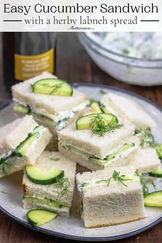 cucumber sandwich cut in half on a plate