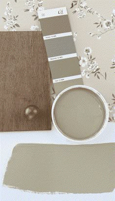 a paint swatch next to a cup of coffee