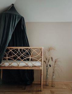 a bed with a black canopy over it