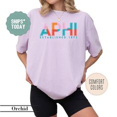 a woman wearing shorts and a t - shirt with the words aphi established 1917