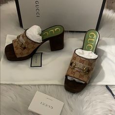 Showcasing Gucci's House Codes, These Gg Mid-Heel Platform Mules Are Made With The House Canvas Monogram And Detailed With A Gold-Tone Horsebit. The Open-Toe Style Has A Square Toe And Brown Suede Trims, Reminiscent Of The '90s. Nostalgia Never Goes Out Of Style. Featuring A Slip-On Style, A Square Toe, An Open Toe, A Monogram Pattern, A Horsebit Detail, A Chunky High Heel And Gold-Tone Hardware. Made In Italy Composition Lining: Leather 100% Sole: Leather 100% Outer: Suede 100%, Canvas 100% Designer Brown Slip-on Heels, Designer Slip-on Heels With Padded Heel, Gucci Luxury Slip-on Heels, Designer Gucci Brown Heels, Luxury Brown Gucci Heels, Gucci Designer Slip-on Heels, Gucci Luxury Heels With Round Toe, Designer Gucci Heels With Leather Sole, Designer Gucci Heels With Almond Toe