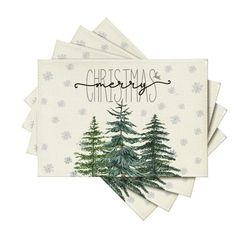 four napkins with christmas trees on them