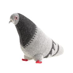 a gray and black bird with red feet standing on its hind legs in front of a white background