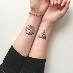 two people with matching tattoos on their arms