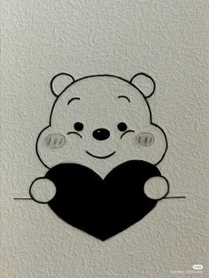 a drawing of a teddy bear holding a heart