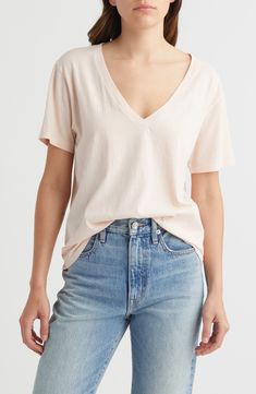 Fall for the slouchy fit of this oversized drop-shoulder T-shirt made from pure cotton. 26" length (size Medium) V-neck Short sleeves 100% cotton Machine wash, tumble dry Imported Spring Oversized V-neck T-shirt, Relaxed Fit Cotton V-neck Top For Loungewear, Cotton Relaxed Fit V-neck Top For Loungewear, Relaxed Fit Cotton V-neck Top With Short Sleeves, Soft-washed Relaxed Fit V-neck Tops, Summer Cotton V-neck Top With Relaxed Fit, Relaxed Fit V-neck Top For Summer Loungewear, Basic Cotton V-neck Top For Summer, Casual V-neck Short Sleeve Top For Loungewear