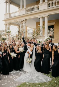 Wedding party wearing all black with bride and groom at Hotel Ella wedding in Austin Texas Black Bridesmaids Gray Groomsmen, Guests Wear All Black Wedding, Bride And Groom Pictures With Bridal Party, All Black Wedding Guest Photos, Spring Wedding With Black Bridesmaid Dresses, Bride And Groom In White Wedding Party In Black, Wedding Couple Sitting Area Decor, All Black Bridal Party Dresses