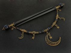 "Set of two beautiful hair sticks with blue goldstone (know also as sandstone / stellaria / night of Kairo) round beads in various sizes. Along with two hair sticks, there is a beautiful, long REMOVABLE pendant / chain - which gives you more possibilities to create beautiful up-do. Chain is decorated with moons and stars. If you're not currently into connected hair sticks, you can simply take off the pendant. * Total length: 17,6cm / 6,9\" * Usable length: 13,5cm / 5,3\" * Pendant length: 19,5cm Wooden Hair Sticks, Japanese Kanzashi, Estilo Hippie, Magical Jewelry, Blue Goldstone, Fantasy Jewelry, Diy Schmuck, Hair Sticks, Fantasy Fashion