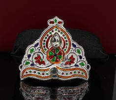 This is crown or mukut for all deities and god or goddess. It represents power, legitimacy, victory, triumph, honour, and glory, as well as immortality, righteousness, and resurrection Vintage antique design handmade 925 sterling silver hat(crown)mukut for little god statues, best Krishna mukut, silver god costume from India. Metal-sterling silver Item type-16.550 grams. Height-6.5centimeter.(2.6") Width-7.5cm approx.(3.0") Stamped-925. We will attach thread on both side to proper use on head of Antique Design, Costume Hats, Costume Accessories, Krishna, Victorious, Headpiece, Vintage Antiques, Special Gifts, Crown