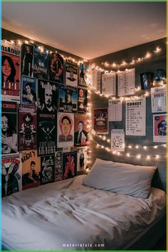 a bedroom with posters and lights on the wall