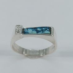 This elegant Turquoise ring has been carefully handcrafted in 925 sterling silver and Diamonds . This impressive ring will make a beautiful birthday/special occasion gift. Once ring has been shipped a tracking number will be provided to you. Free shipping! Ring Measurements: Ring is size 7 1/2 but can be resized at no extra cost and it will be shipped to you in an elegant gift box. Ring weights 2.7 grams Ring Band is: 4.50 mm at widest point and 3.0 mm at smallest point Size: 7 1/2 Materials: Tu Hallmarked Turquoise Sterling Silver Ring For Anniversary, Artisan Sterling Silver Turquoise Ring For Anniversary, Blue Turquoise Ring With Polished Finish In Sterling Silver, Turquoise Sterling Silver Rings With Polished Finish, Anniversary Hallmarked Turquoise Sterling Silver Ring, Artisan Blue Turquoise Ring With Polished Finish, Blue Turquoise Promise Ring In Sterling Silver, Artisan Blue Ring Stamped 925, Sterling Silver Turquoise Opal Promise Ring