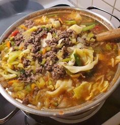 a large pot filled with soup on top of a stove