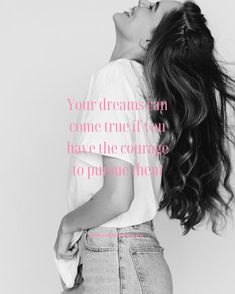 a woman with her hair blowing in the wind and texting your dreams can come true if you have the courage to pursue them