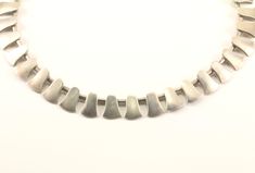 This is Vintage Teeth Design Necklace Condition: Vintage Metal: Sterling .925 Silver Weight: 73 grams Size: 15.5 in Images you see are actual pictures of jewelry you will receive Every purchase comes thoughtfully packaged and ships within 1 business day New York State buyer will be charged sales tax Feel free to contact us with any questions. We are open Mon-Fri 9-5 EST We appreciate your business Contemporary Round Sterling Silver Necklaces, Modernist Necklace With Polished Finish For Gifts, Modern Sterling Silver Necklace For Collectors, Contemporary Sterling Silver Necklace For Formal Occasions, Contemporary Sterling Silver Necklaces For Formal Occasions, Contemporary Hallmarked Jewelry As Gift, Contemporary Necklace With Polished Finish As Gift, Contemporary Silver Jewelry For Anniversary, Contemporary Polished Finish Necklace For Gift