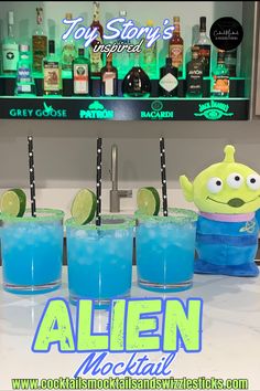 This image shows three blue drinks with lime green rims with black star straws and a lime wheel granish with a Toy Story Alien plush in front of a home bar. Pizza Planet Party Ideas, Toy Story Alien Party, Toy Story Themed Dinner, Toy Story Dinner And A Movie, Toy Story Inspired Food, Disney Themed Snacks, Pizza Planet Party, Toy Story Food Ideas