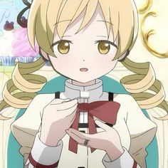 an anime character with blonde hair and brown eyes holding a red bow in her hands