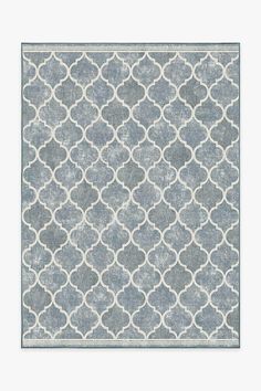 a gray and white rug with circles on it