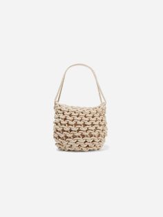 The Dora Bag is hand woven in Italy with organic rope for the optimal shoulder bag. Organic Cotton Lining:. drawstring closure . inside pocket . size: h 33 x w 31 cm CARE INSTRUCTIONS. 100% organic cotton . dry clean Casual Bucket Bag With Braided Details, Casual Cotton Bucket Bag With Double Handle, Casual Braided Tote Bucket Bag, Beige Cotton Bucket Bag With Adjustable Strap, Beige Braided Bucket Bag Tote, Beige Braided Bucket Tote Bag, Cream Woven Shoulder Bag For Everyday, Everyday Cream Woven Shoulder Bag, Casual Beige Woven Hobo Bag