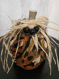 an animal print pumpkin sitting on top of a table