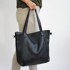 "BIG Shoulder Bag, Shopper Bag for Woman - Tote Bag - Large Crossbody Purse - Handbag with Brass Color Hardware Big SHOPPER LEATHER BAG Leather handbag made of 100% high quality natural leather. Fits all size laptops, 17\" fills the whole bag + room for a couple of books, wallet Brass Color Hardware adds style to the shoulder bag. Inside the shopper bag there is a pocket with zipper - for your keys, lip gloss, iPhone, glasses The bag can be worn on the shoulder or in hand (attachable long strap) Black Shoulder Bag With Zipper Pocket For Shopping, Black Bag With Zipper Pocket For Everyday Use, Black Tote Bag With Zipper Pocket, Everyday Black Bag With Zipper Pocket, Black Handheld Shoulder Bag For Everyday Use, Black Handheld Bag For Everyday, Black Handheld Hobo Bag For Everyday Use, Black Handheld Bag With Zipper Pocket, Black Pouch Bag With Leather Handles