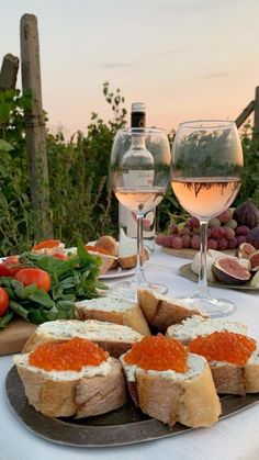 a table topped with bread and glasses of wine